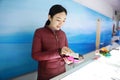 Young happy Beautiful Woman hand with credit card swipe through terminal for sale