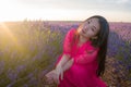 Young happy and beautiful Asian Japanese woman in Summer dress enjoying free and playful in romantic and lovely purple lavender
