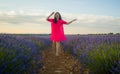 Young happy and beautiful Asian Japanese woman in Summer dress enjoying nature free and playful outdoors at purple lavender Royalty Free Stock Photo