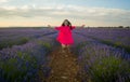 Young happy and beautiful Asian Japanese woman in Summer dress enjoying nature free and playful outdoors at purple lavender Royalty Free Stock Photo