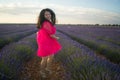 Young happy and beautiful Asian Japanese woman in Summer dress enjoying nature free and playful outdoors at purple lavender Royalty Free Stock Photo