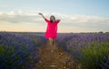 Young happy and beautiful Asian Japanese woman in Summer dress enjoying nature free and playful outdoors at purple lavender Royalty Free Stock Photo