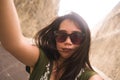Young happy and beautiful Asian Korean Chinese taking selfie photo with mobile phone posing playful and carefree in sunglasses Royalty Free Stock Photo
