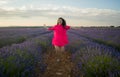 Young happy and beautiful Asian Korean woman in Summer dress enjoying nature running free and playful outdoors at purple lavender Royalty Free Stock Photo