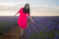 Young happy and beautiful Asian Korean woman in Summer dress enjoying nature running free and playful outdoors at purple lavender Royalty Free Stock Photo