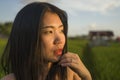 Young happy and beautiful Asian woman enjoying nature at rice field. sweet Chinese girl exploring countryside during holiday Royalty Free Stock Photo