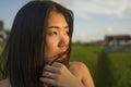 Young happy and beautiful Asian woman enjoying nature at rice field. sweet Korean girl exploring countryside during holiday travel Royalty Free Stock Photo