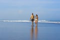 Young happy and beautiful couple enjoying Summer holidays travel or honeymoon trip together in tropical paradise beach having fun Royalty Free Stock Photo