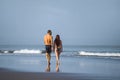 Young happy and beautiful couple enjoying Summer holidays travel or honeymoon trip together in tropical paradise beach having fun Royalty Free Stock Photo