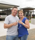 Young happy and beautiful couple in love drinking champagne or wine having sweet toast celebrating anniversary or valentines day o