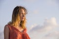 Oung happy beautiful and glamorous blond woman posing as at the beach wearing stylish dress smiling cheerful feeling fresh and fre Royalty Free Stock Photo