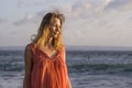 Oung happy beautiful and glamorous blond woman posing as at the beach wearing stylish dress smiling cheerful feeling fresh and fre Royalty Free Stock Photo