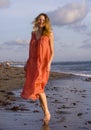 Oung happy beautiful and glamorous blond woman posing as at the beach wearing stylish dress smiling cheerful feeling fresh and fre Royalty Free Stock Photo