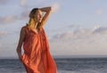 Young happy beautiful and glamorous blond woman posing as at the beach wearing stylish dress smiling cheerful feeling fresh and fr Royalty Free Stock Photo