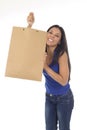 Young happy and beautiful hispanic woman holding brown shopping bag smiling excited isolated on white Royalty Free Stock Photo