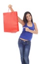 Young happy and beautiful hispanic woman holding red shopping bag smiling excited isolated on white Royalty Free Stock Photo