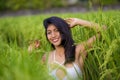 Young happy and beautiful latin woman smiling playful having fun posing sexy isolated on green rice field in Asia tourist trip and Royalty Free Stock Photo