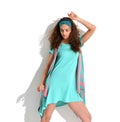 Young happy beautiful woman posing in mint and pink fashion body dress cloth Royalty Free Stock Photo