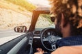 Young happy black man driving convertible car. Royalty Free Stock Photo