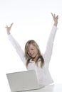 Young happy blonde woman at the computer