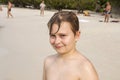 Young happy boy with brown wet hair is smiling and enjoying the Royalty Free Stock Photo