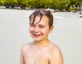 Young happy boy enjoys the tropical beach Royalty Free Stock Photo