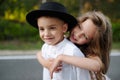 Young happy boy and girl together outside