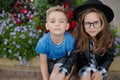 Young happy boy and girl together outside