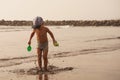 Young happy boy jumping into the air on tropical beach Royalty Free Stock Photo