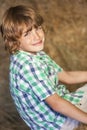 Young Happy Boy Smiling on Hay Bales Royalty Free Stock Photo