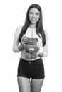 Young happy Brazilian woman smiling while holding teddy bear with heart and love sign Royalty Free Stock Photo