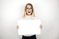 Young happy business woman in eyeglasses holding blank sheet of paper for announcement isolated white background space Royalty Free Stock Photo