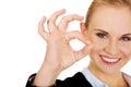 Young happy business woman shows OK sign Royalty Free Stock Photo