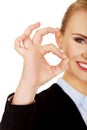 Young happy business woman shows OK sign Royalty Free Stock Photo