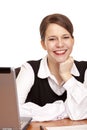 Young happy business woman sits on desk in office Royalty Free Stock Photo