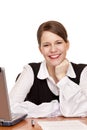 Young happy business woman sits on desk in office Royalty Free Stock Photo