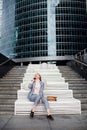 Young happy business woman talking on the phone in the background of an office building Royalty Free Stock Photo
