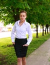 Young and happy business woman walking in city green park Royalty Free Stock Photo