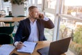 Young happy businessman calling phone in business centre. Work hub concept Royalty Free Stock Photo