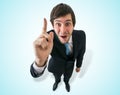 Young happy businessman have an idea and holds finger up. Royalty Free Stock Photo