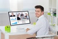 Businessman Videoconferencing On Computer