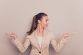 Young happy businesswoman gesturing with hands and showing balance Royalty Free Stock Photo