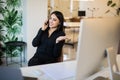 Young happy businesswoman talking on the phone in office Royalty Free Stock Photo
