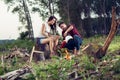 Young camping couple cooking meal