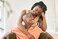 Young happy carefree and cheerful african american couple bonding and enjoying relaxing time together at home. Loving Royalty Free Stock Photo