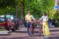 Young happy caucasian couple on bikes in old Royalty Free Stock Photo