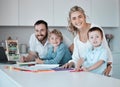 Young happy caucasian family having fun together at home. Loving parents helping their little children with homework Royalty Free Stock Photo