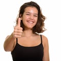 Young happy Caucasian teenage girl smiling giving thumb up