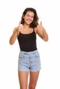 Young happy Caucasian teenage girl smiling and giving thumbs up Royalty Free Stock Photo