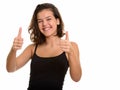 Young happy Caucasian teenage girl smiling and giving thumbs up Royalty Free Stock Photo